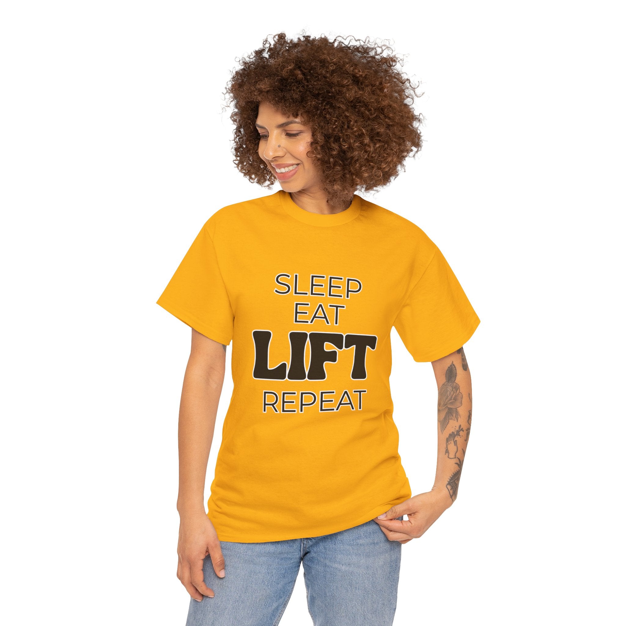 Woman wearing a Golden Yellow coloured T-Shirt with the text "Sleep, Eat, Lift, Repeat" on it.